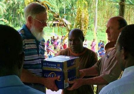 William Butler, Maso the PNG translator and John Pryor receiveing the book of Acts